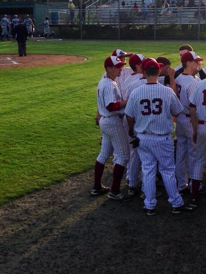 Bengston (left) huddles with his teammates