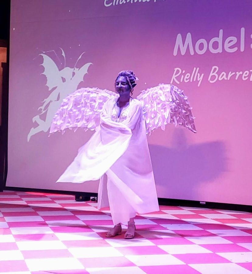 Rielly Barrett models the Tundra Dark Fae look created by Elianna Fontanez and Jaelyn Bonilla at the Mythical Hair! Hair Show 2022 at Concord High School.