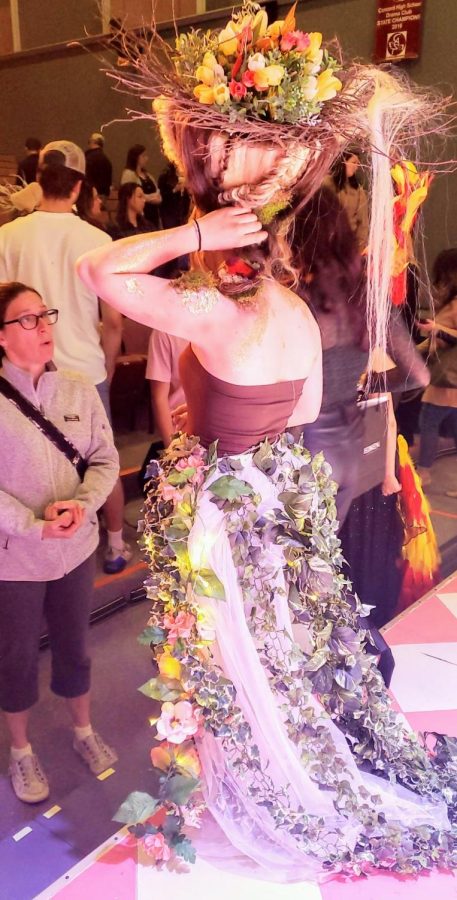 Jackie Carey shows off the Mother Nature look designed by Maddie Ashford and Sophia Ferris at the Mythical Hair! Hair Show 2022 at Concord High School.