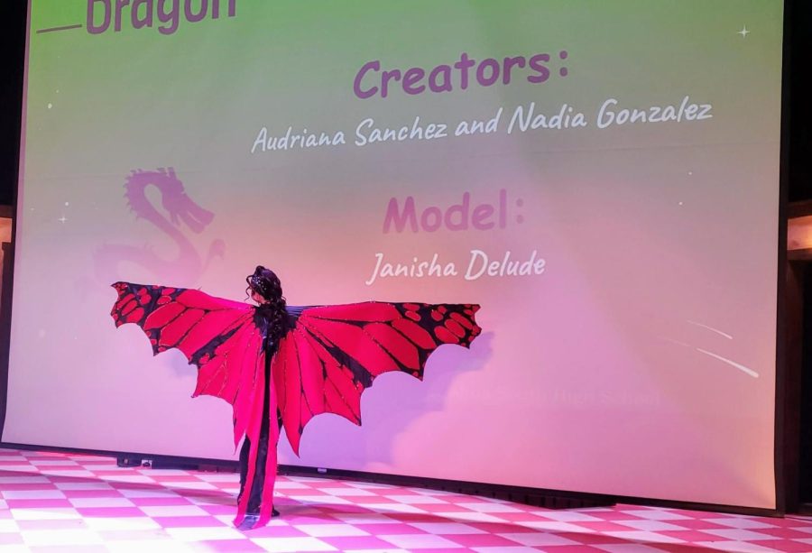 Janisha Delude shows off the back of the Dragon look created by Audriana Sanchez and Nadia Gonzalez at the Mythical Hair! Hair Show 2022 at Concord High School.