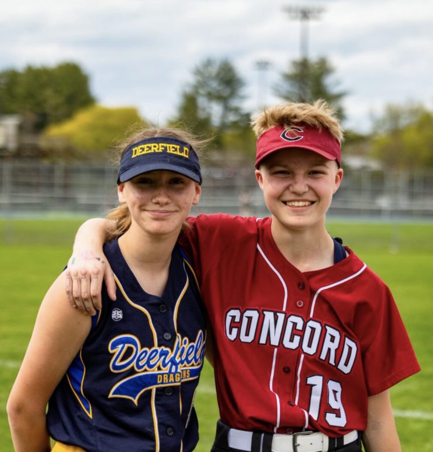 CHS outfielder Andie Moreira, a freshman, poses with a Deerfield Community School athlete who hopes to join the varsity squad when she attends Concord High next year.