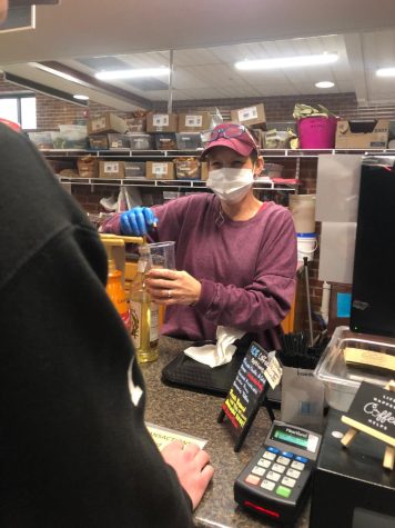 Carrie Wyatt may be wearing a mask but students and staff can still see her smiling eyes as she deftly serves customer after customer at the Corner Cafe.