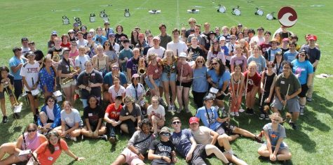 The 2022-2023 marching band poses during the first day of band camp last summer.