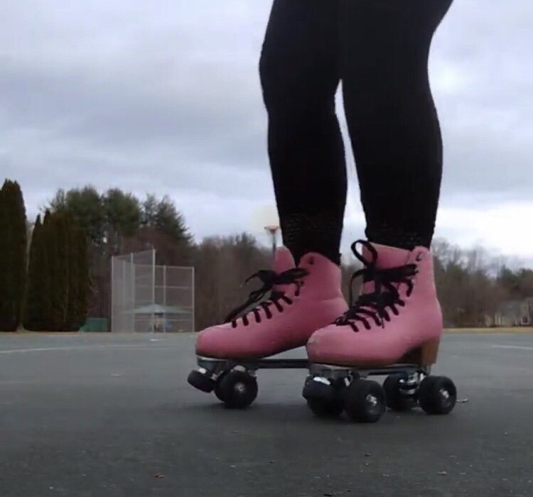 Photograph: Pink roller skates with black laces