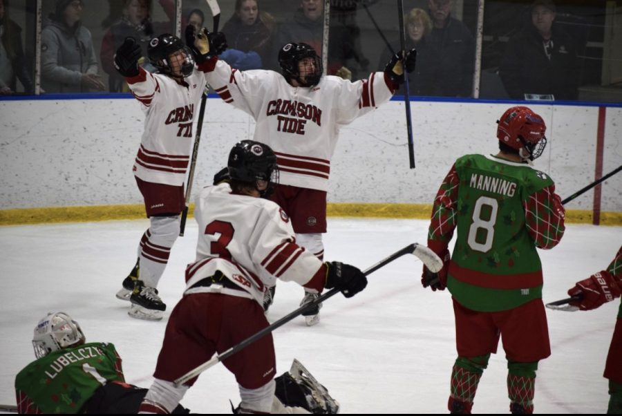 CHS celebrates following a goal against Trinity during the Brian C. Stone Memorial Christmas Tournament. From left to right: Carter Doherty, Brooks Craigue (#3) and AJ Dow.