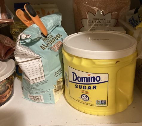 The bright yellow and bold blue letters contrasted with the empty cabinet.