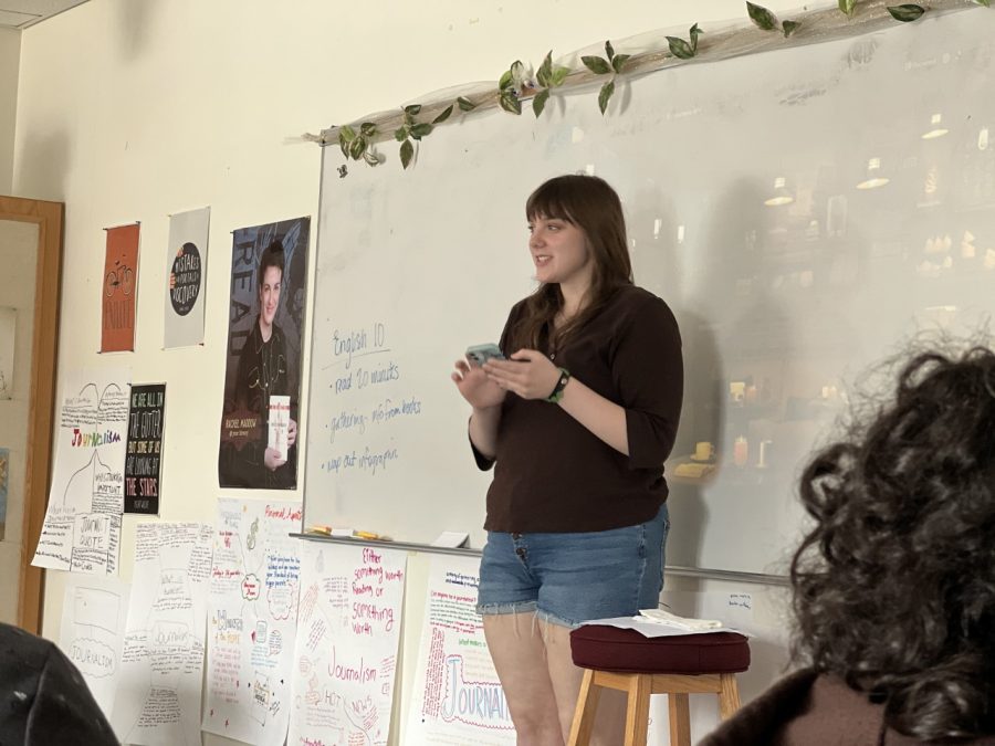 Ceianna Dempsey, a junior at CHS, takes a turn reading poetry at a Writing Club event Monday, May 8, 2023.
