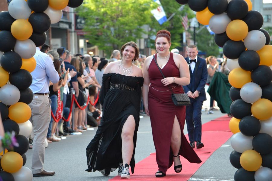 Kaen Lovette and Mori Patton (with Adam Gilbert right behind them) walk the red carpet before the prom at Bank of New Hampshire Stage on South Main Street Thursday, June 15, 2023.