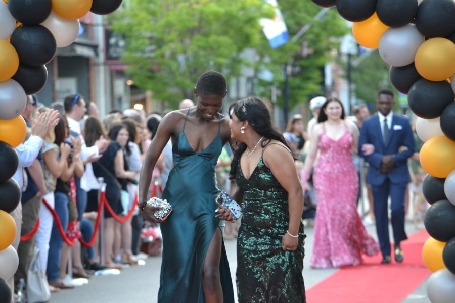 Yvonne Nyiramugisha and Rosima Darjee walk the red carpet before the prom at Bank of New Hampshire Stage on South Main Street Thursday, June 15, 2023.
