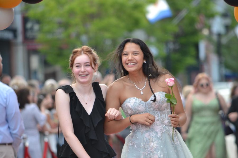 Oliva Lewis and Maria Ruelas walk the red carpet before the prom at Bank of New Hampshire Stage on South Main Street Thursday, June 15, 2023.